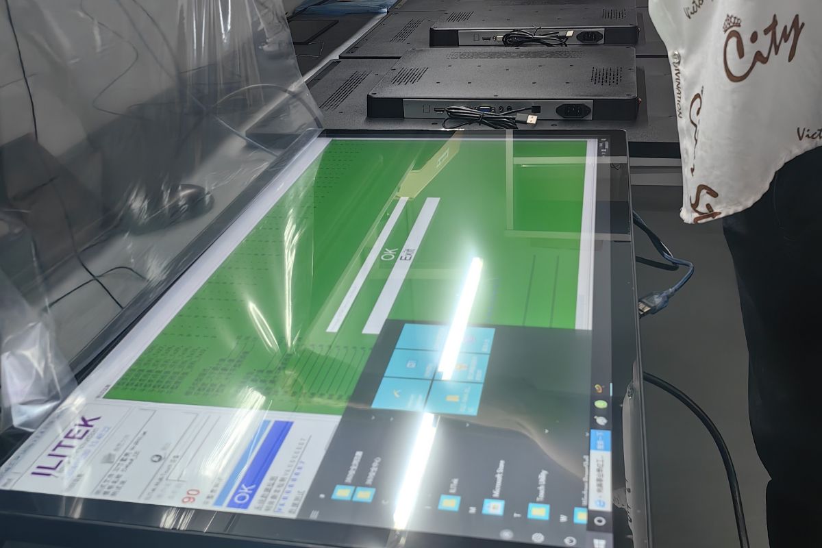 Functional testing station for touch, display, and interface verification